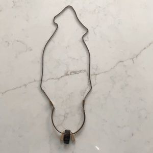 Handmade necklace with a rectangular brown stone.